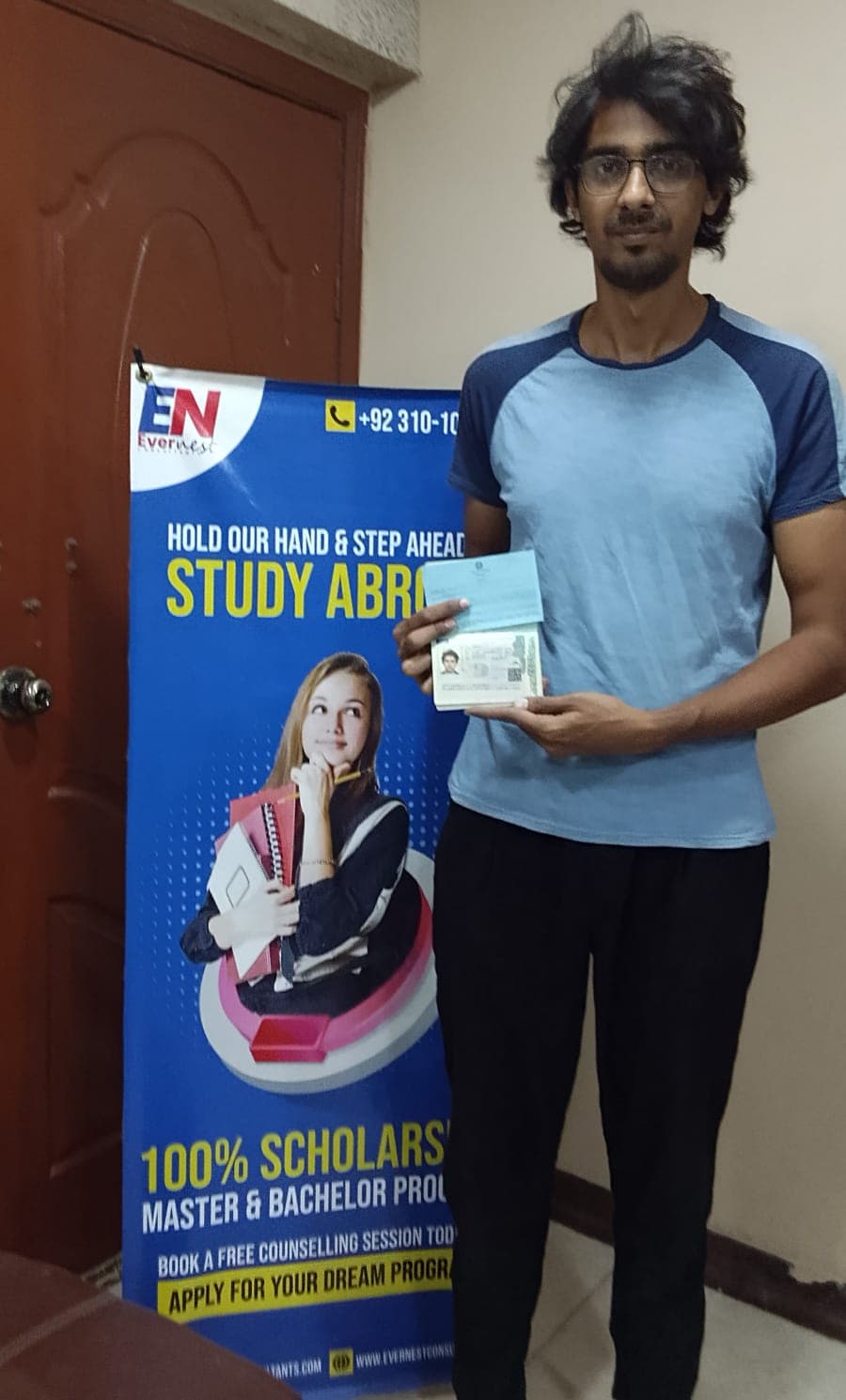 Success Story 3 holding visa approval documents