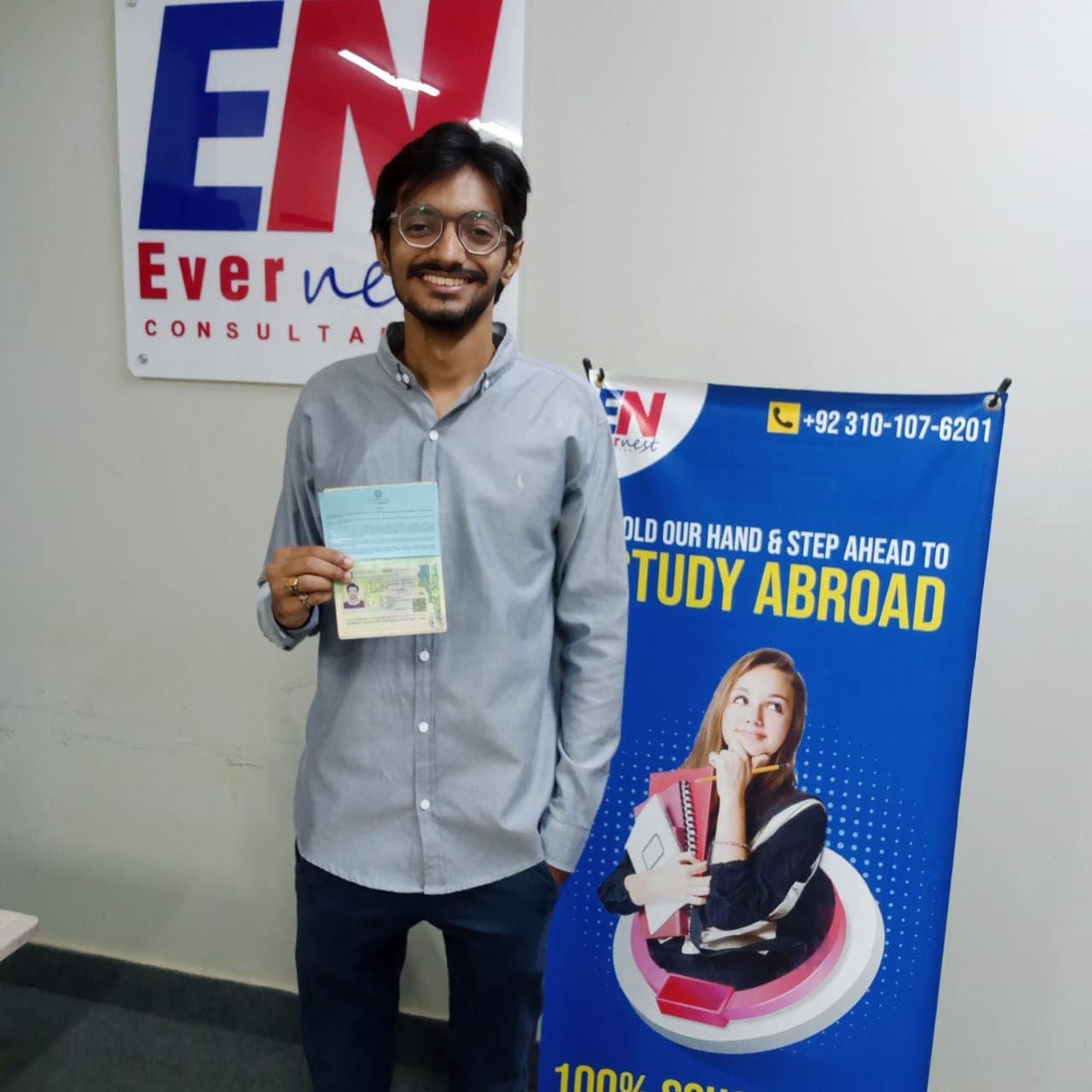 Success Story 5 holding visa approval documents